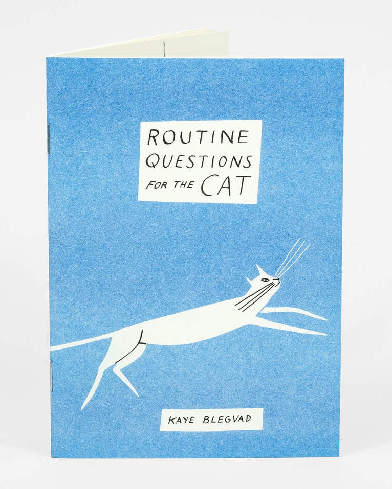 Blue book cover with a white cat illustration and text &